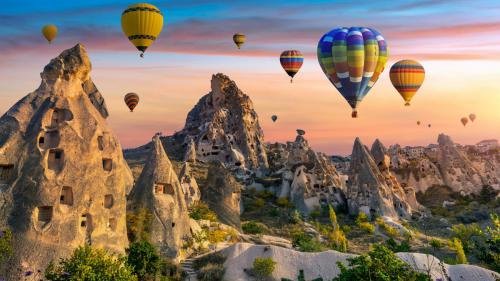 Colorful hot air balloon flying over Cappadocia, Turkey.